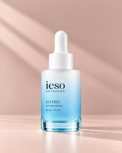 MATRIX Peptide Serum by Ieso Skincare, 30 mL frosted dropper bottle on a blush background with soft window light